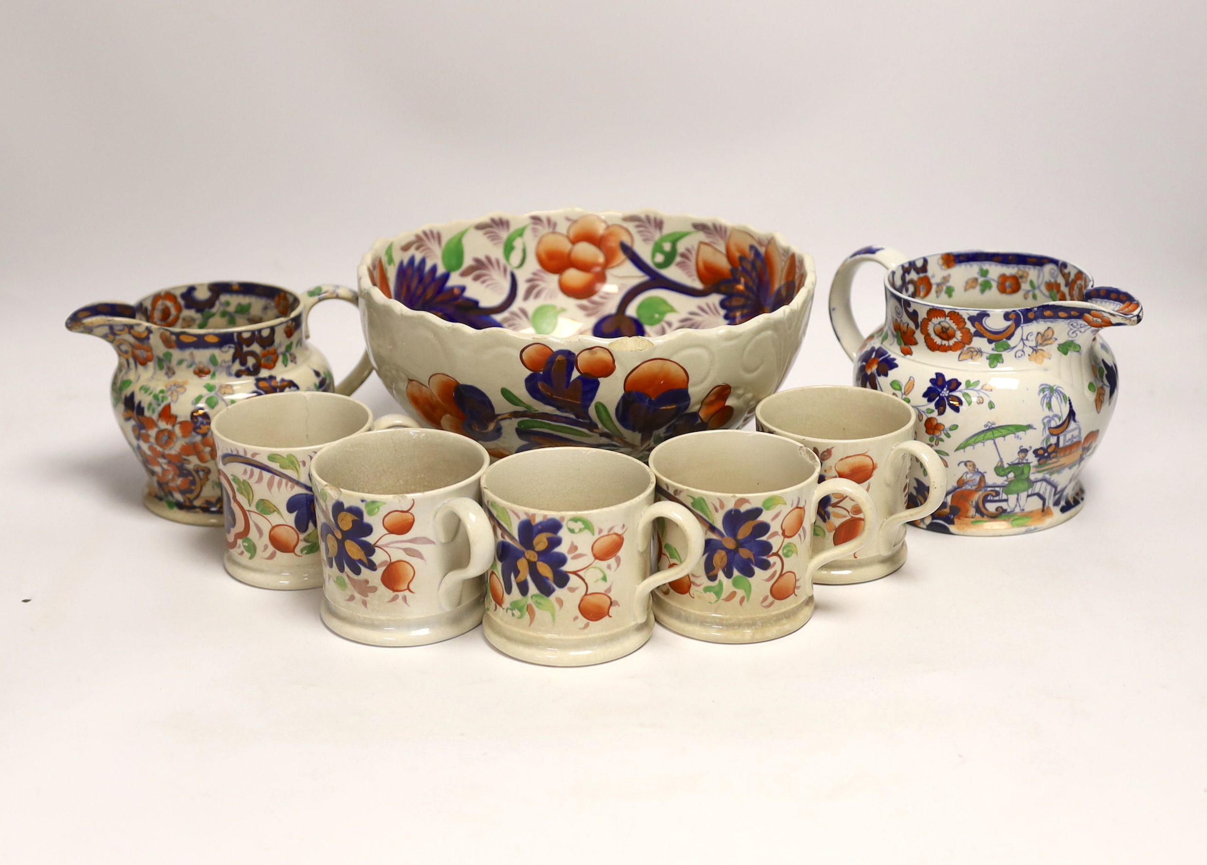 Five Welsh ‘Gaudy’ coffee cans, a large pedestal bowl and two Staffordshire jugs, bowl 21cm diameter